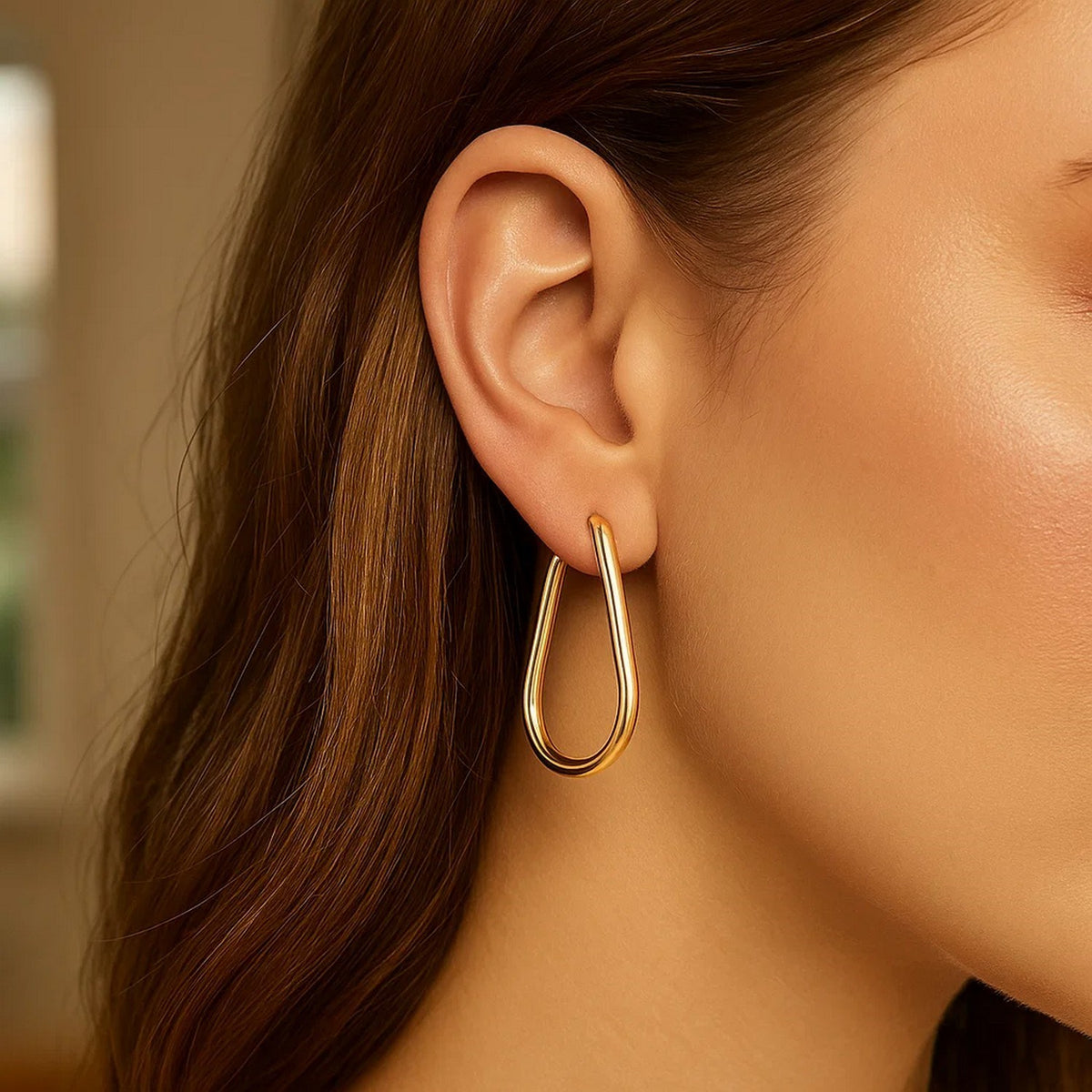 Pear-Shaped Endless Hoop Earrings in 14K Yellow Gold, worn