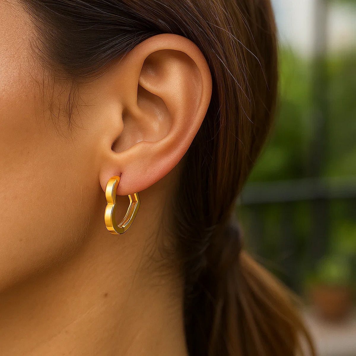 Heart Huggie Hoop Earrings in 14K Yellow Gold, worn