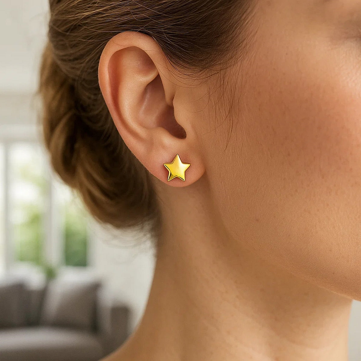 Puffed Star Stud Earrings in 14K Yellow Gold, worn