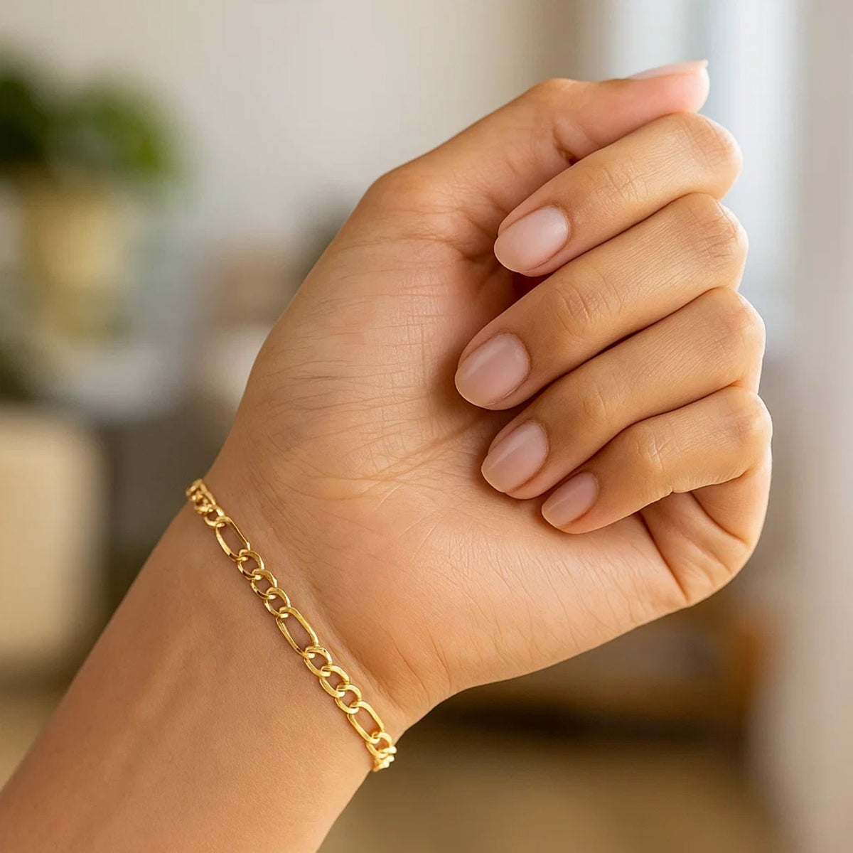 Lightweight Figaro Chain Bracelet in 14K Yellow Gold, worn