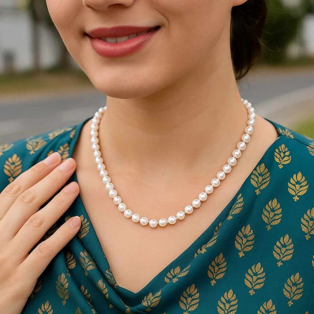 White Freshwater Pearl Strand Necklace in 14K Yellow Gold, worn