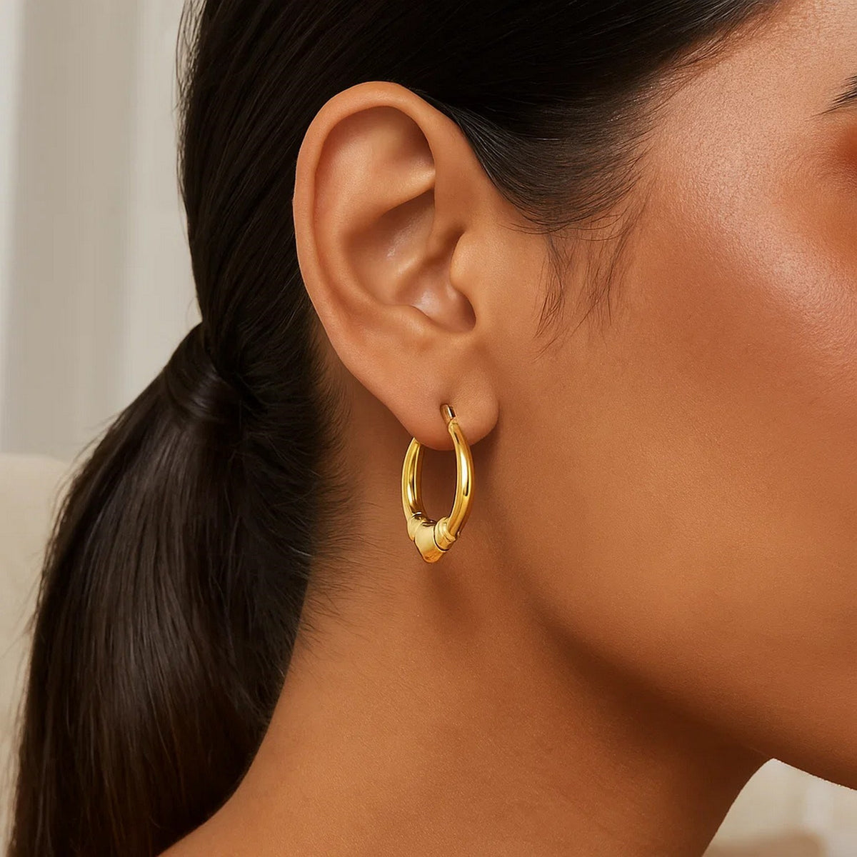 Ribbed Heart Hoop Earrings in 14K Yellow Gold, worn