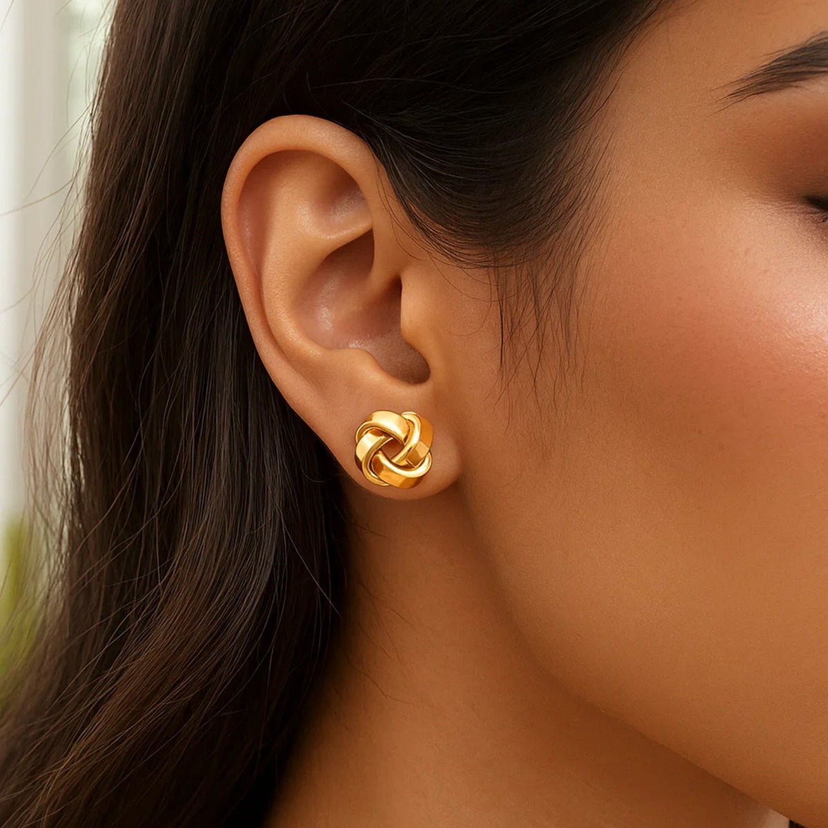 Classic Love Knot Stud Earrings in 14K Yellow Gold, worn