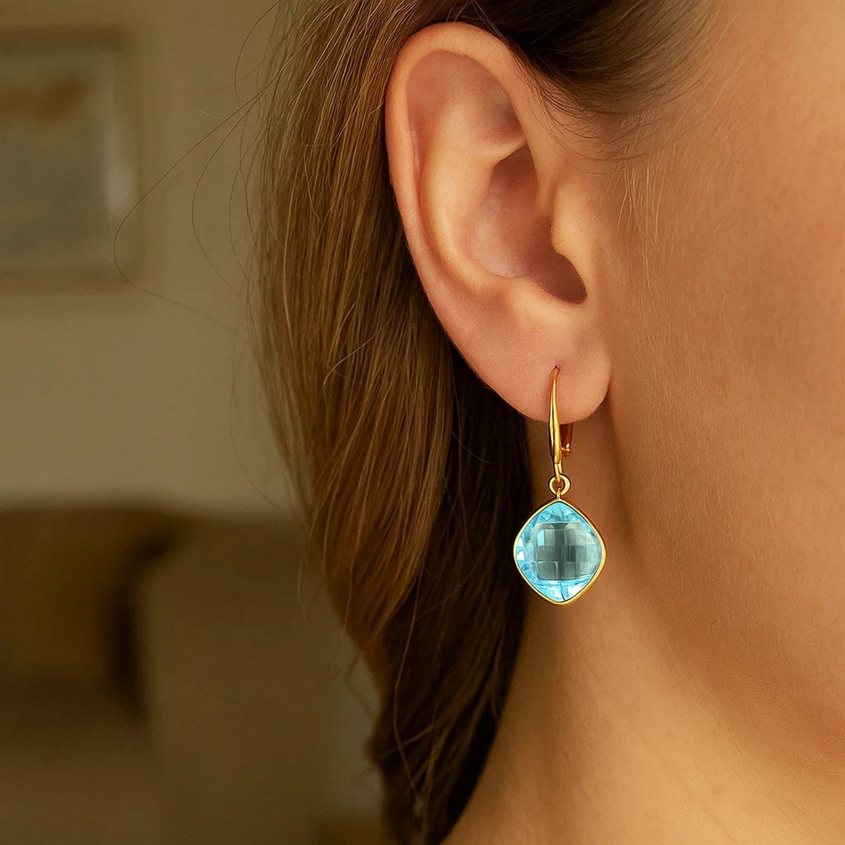 Blue Topaz Cushion Drop Earrings in 14K Yellow Gold, worn