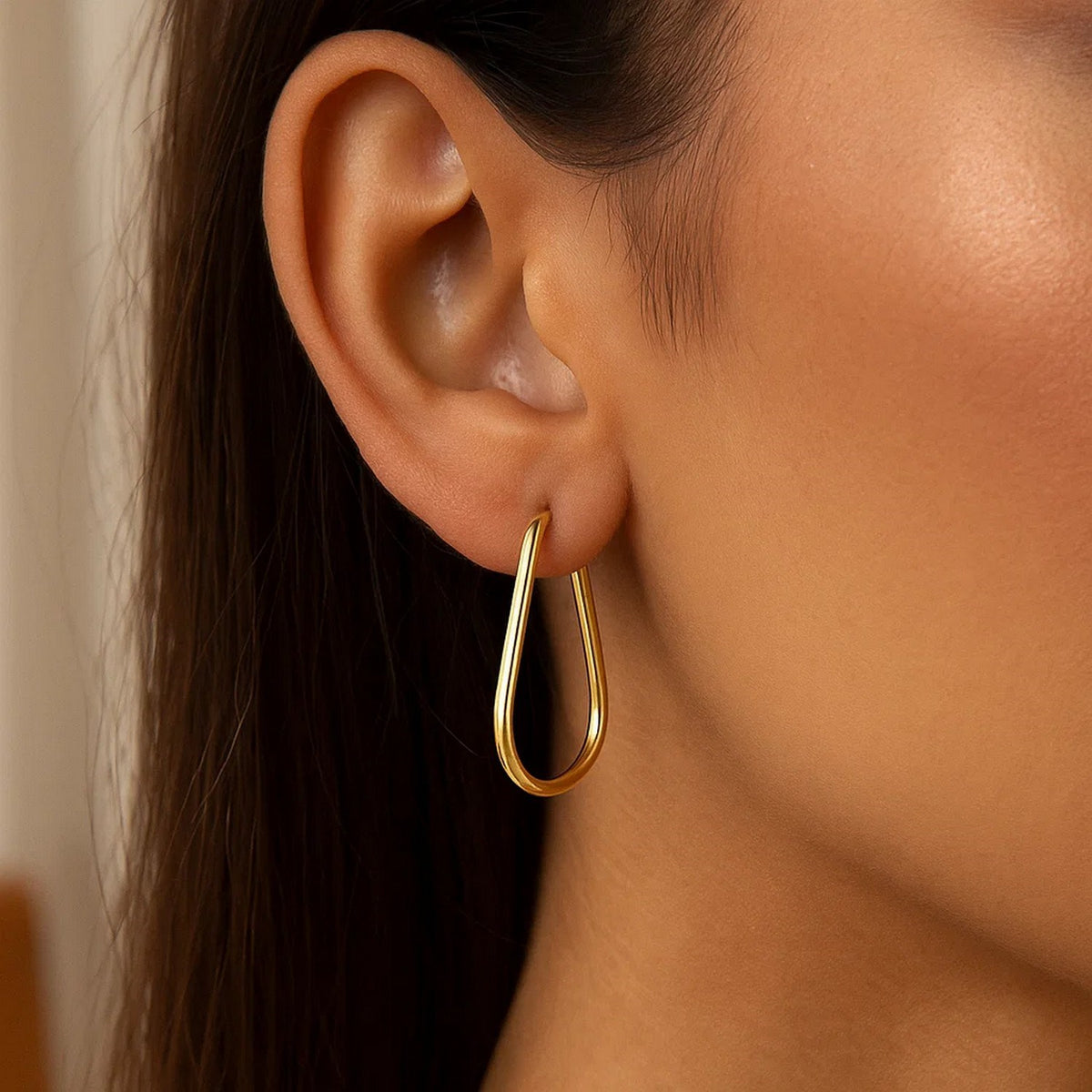 Pear-Shaped Endless Hoop Earrings in 14K Yellow Gold, worn