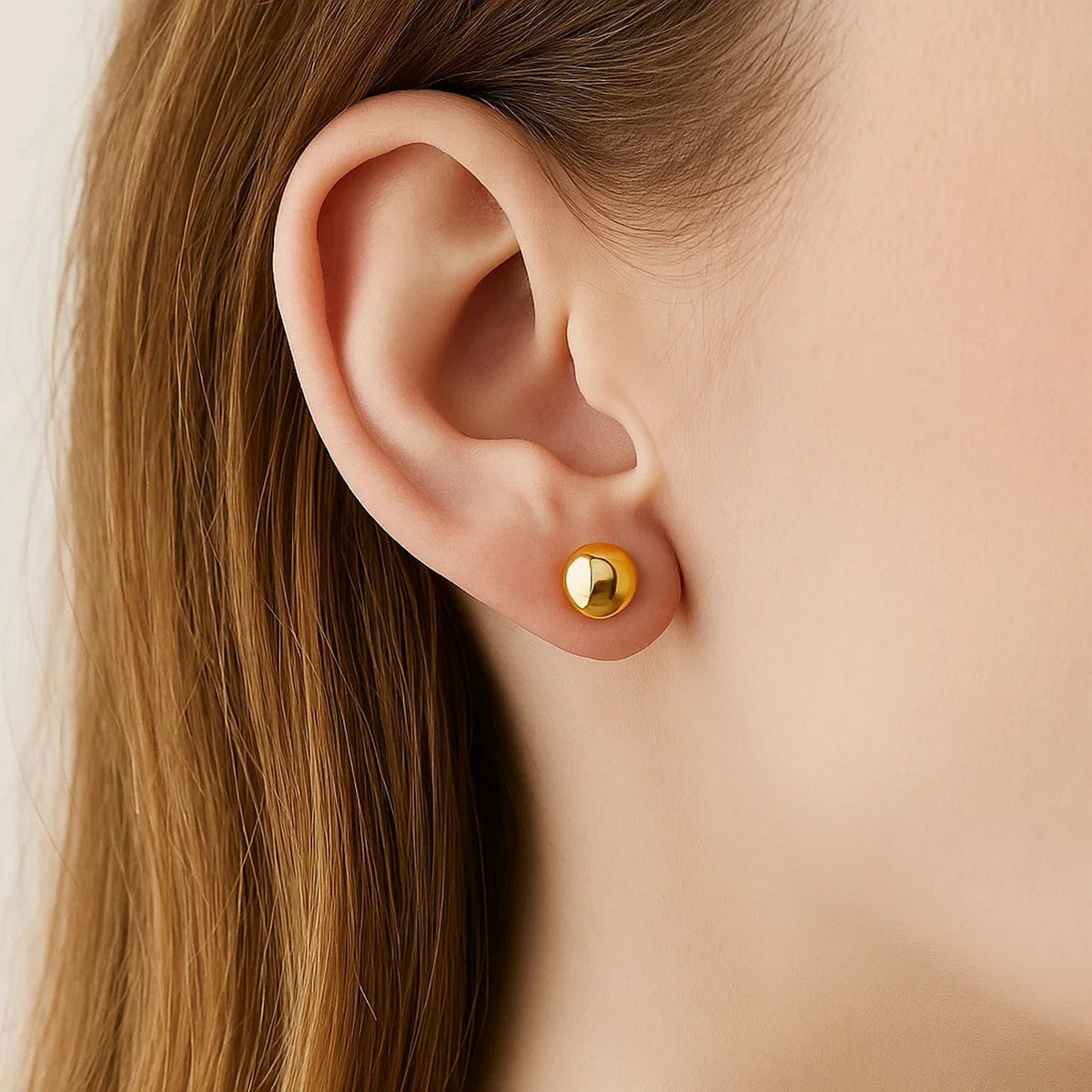 Polished Ball Stud Earrings in 14K Yellow Gold, worn
