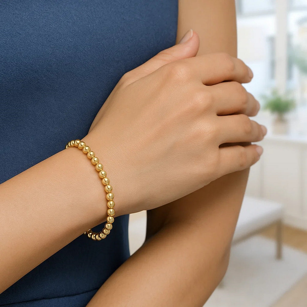 Polished Bead Bracelet in 14K Yellow Gold, worn