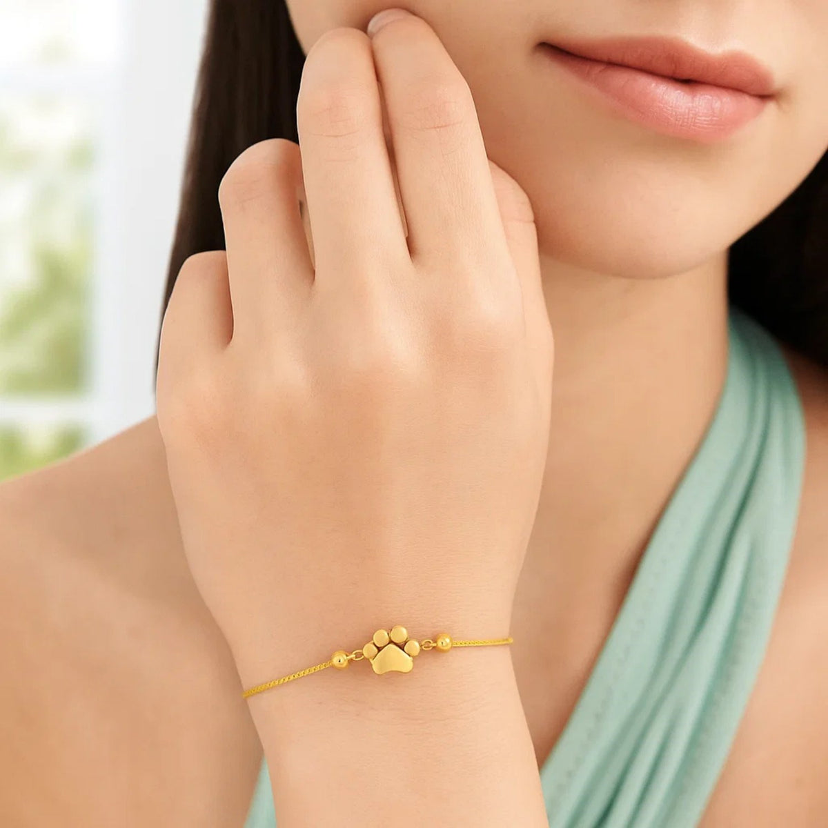 Adjustable Paw Print Bracelet in 14K Yellow Gold, worn