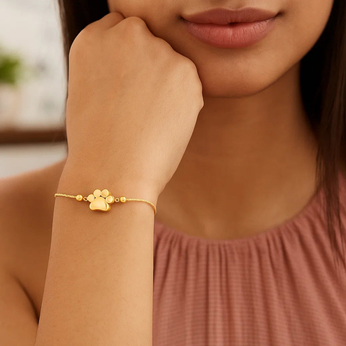 Adjustable Paw Print Bracelet in 14K Yellow Gold, worn