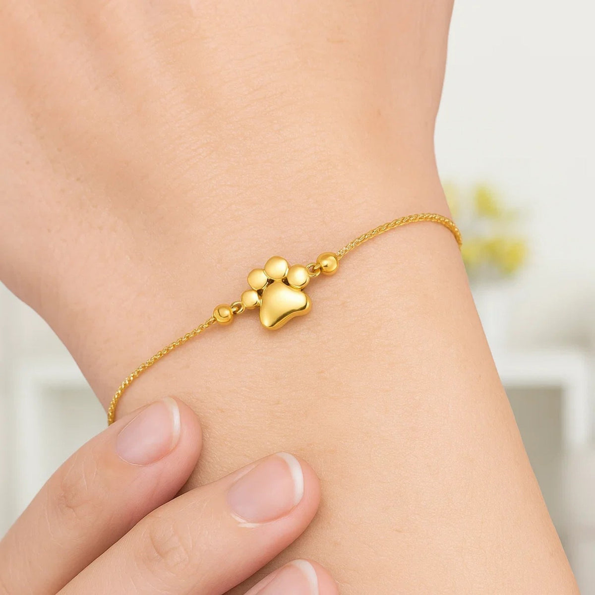 Adjustable Paw Print Bracelet in 14K Yellow Gold, worn