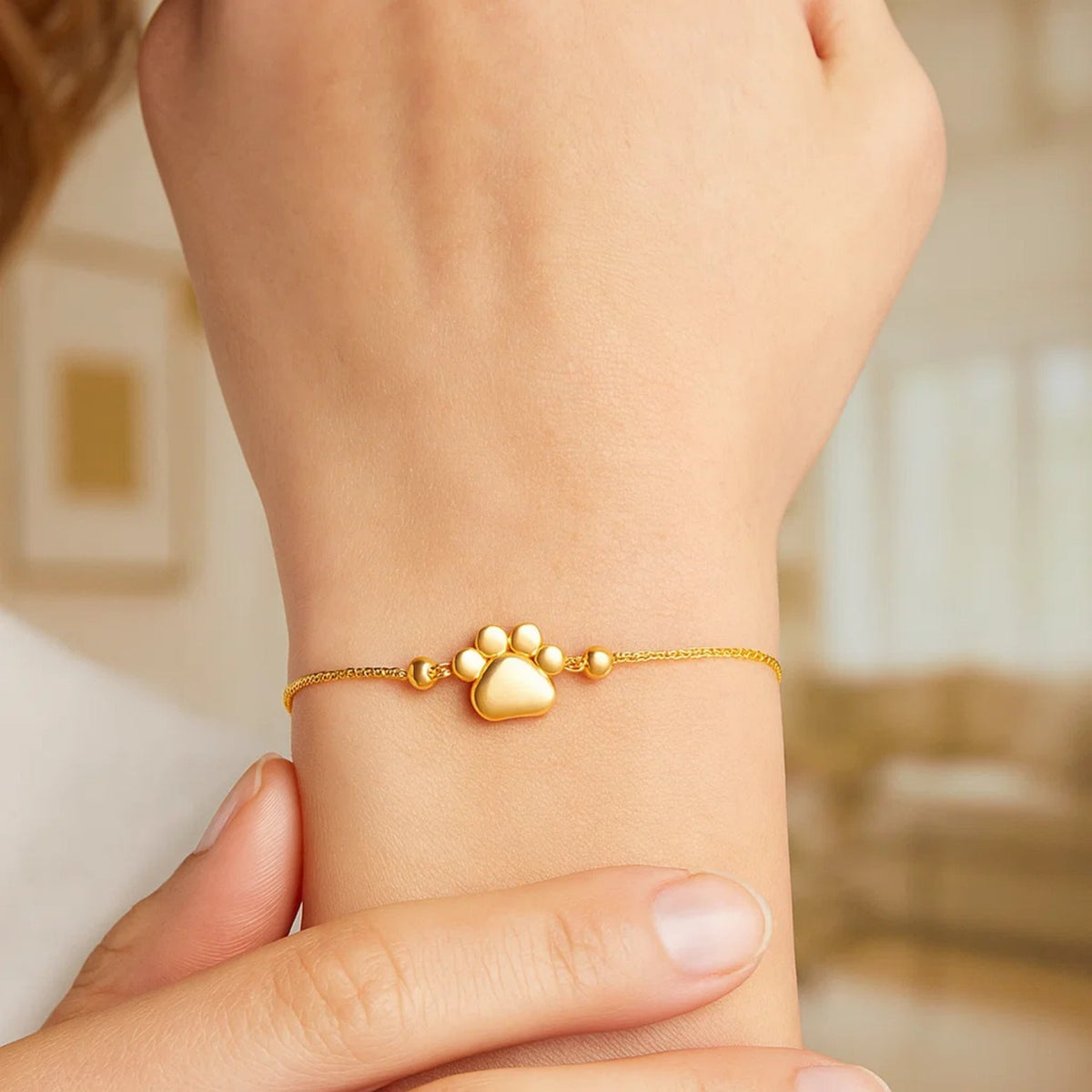 Adjustable Paw Print Bracelet in 14K Yellow Gold, worn