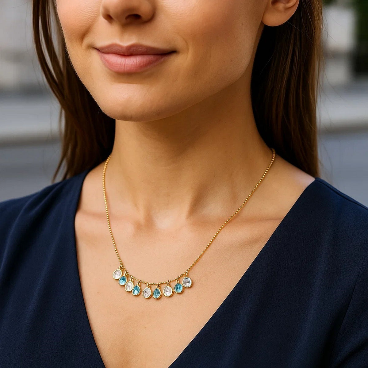 Blue and White Topaz Dancing Drop Necklace in 14K Yellow Gold, worn