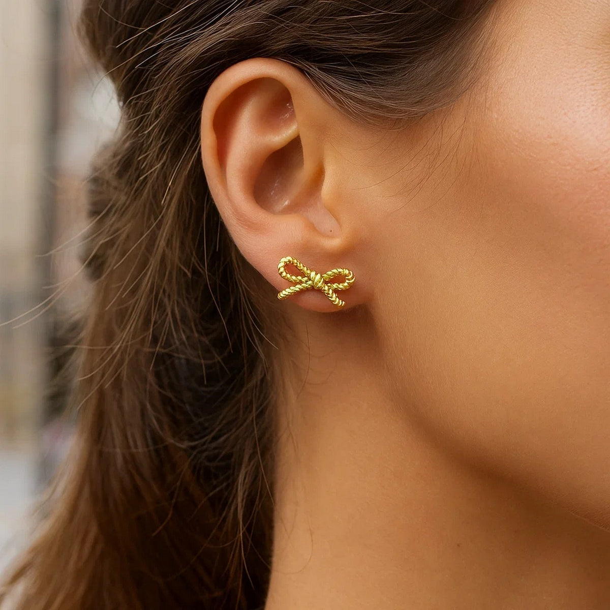 Rope Twist Bow Stud Earrings in 14K Yellow Gold, worn