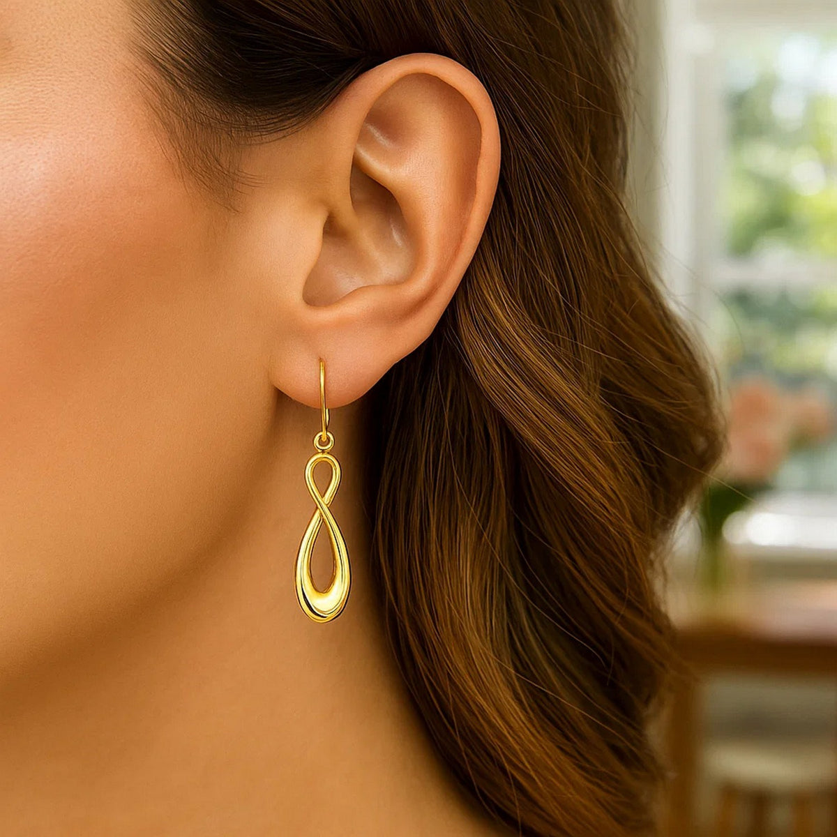 Polished Infinity Drop Earrings in 14K Yellow Gold, worn