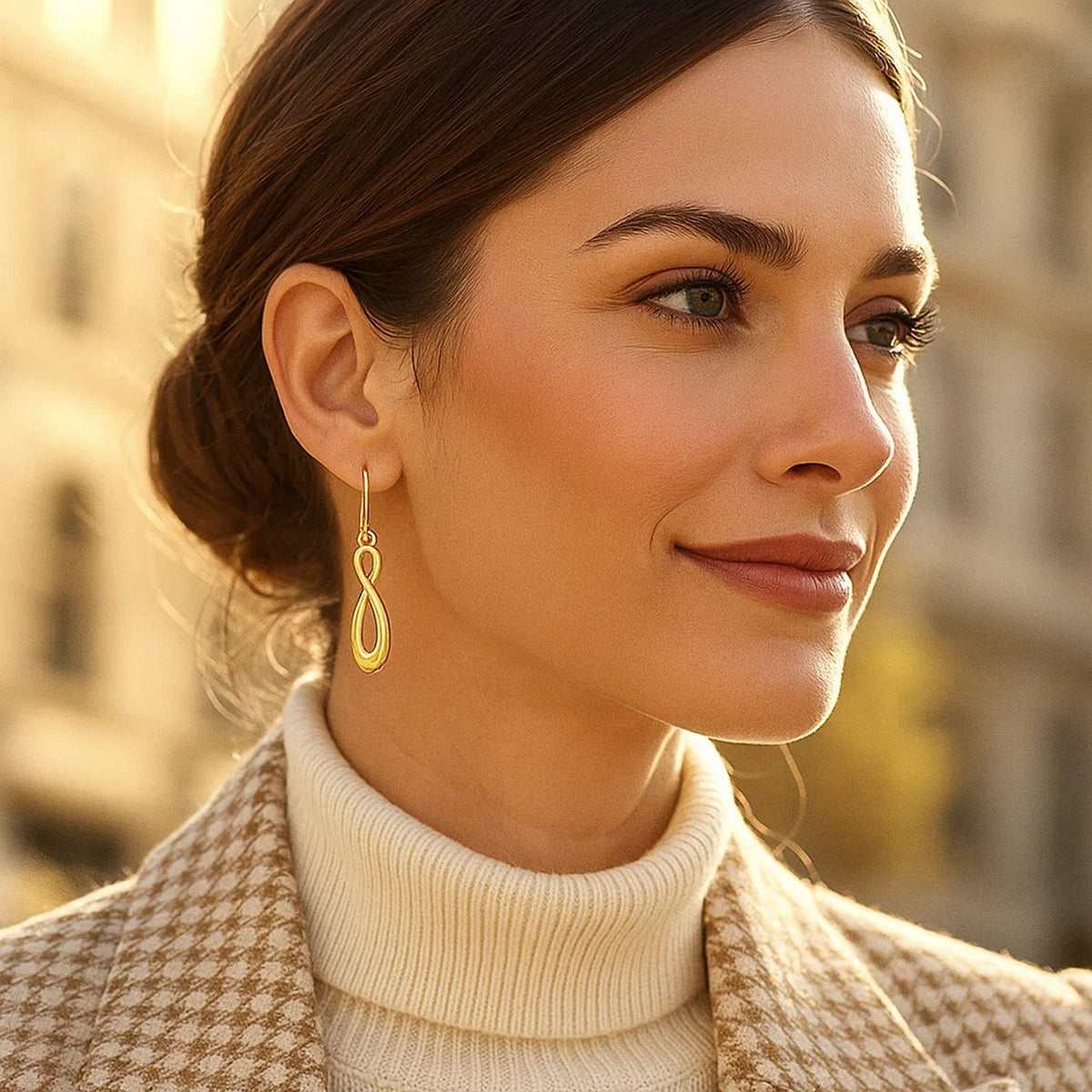 Polished Infinity Drop Earrings in 14K Yellow Gold, worn