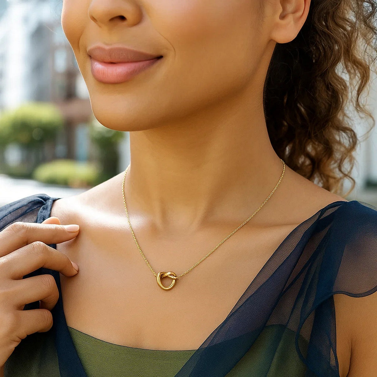 Love Knot Pendant Necklace in 14K Yellow Gold, worn