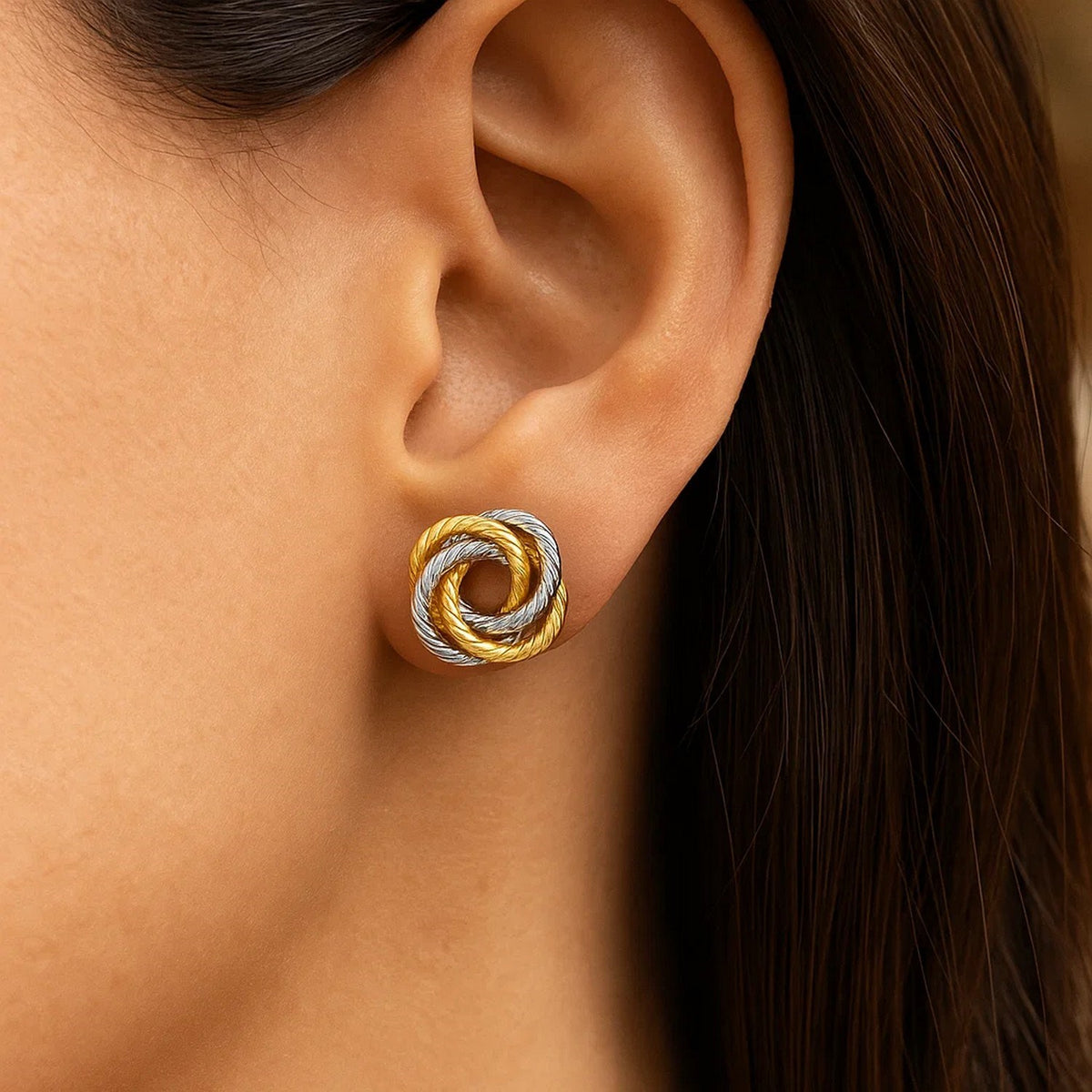 Two-Tone Love Knot Stud Earrings in 14K Gold, worn