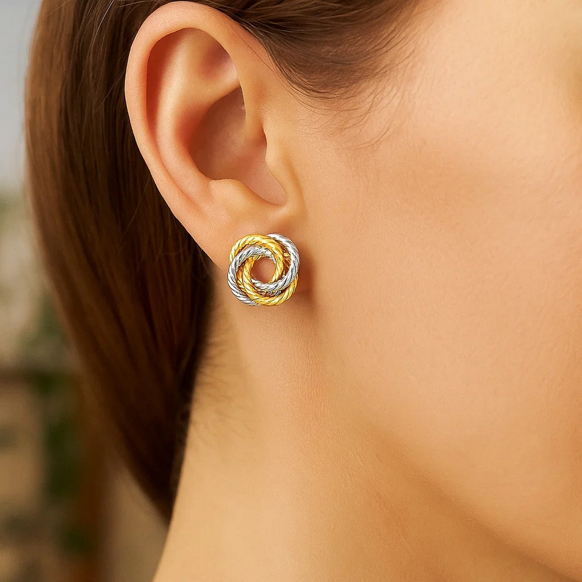 Two-Tone Love Knot Stud Earrings in 14K Gold, worn