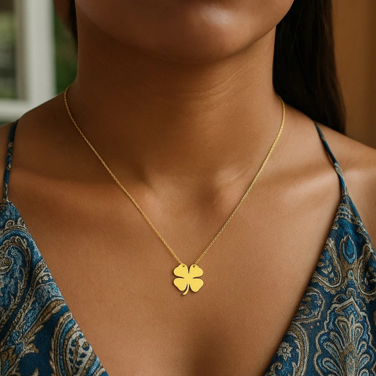Polished Four Leaf Clover Necklace in 14K Yellow Gold, worn