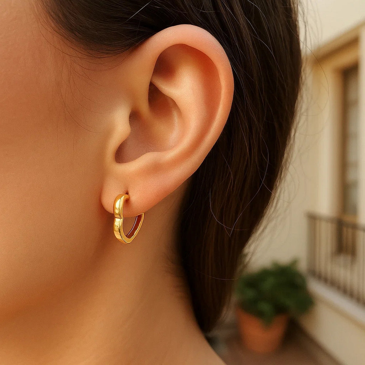 Heart Huggie Hoop Earrings in 14K Yellow Gold, worn