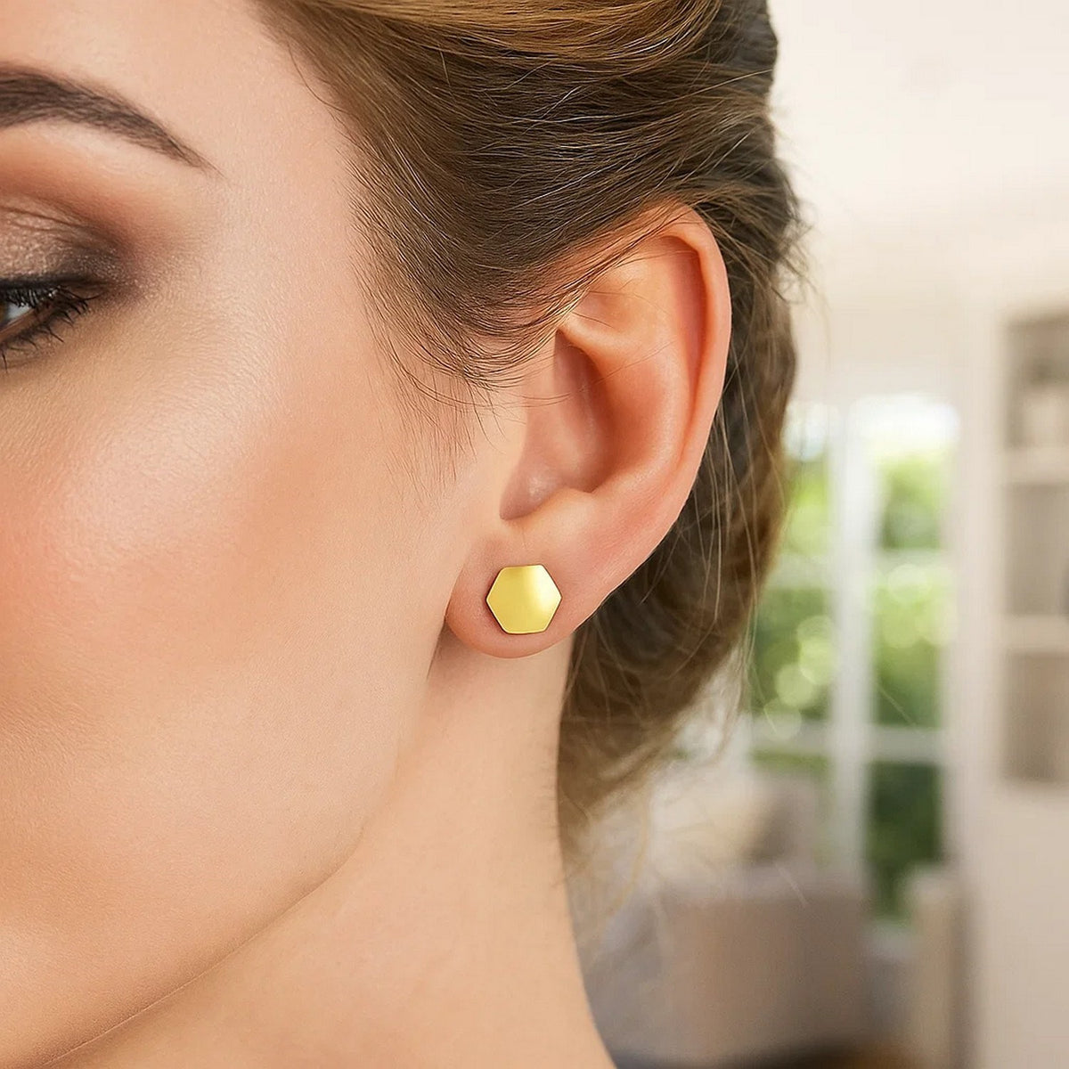 Polished Hexagon Stud Earrings in 14K Yellow Gold, worn