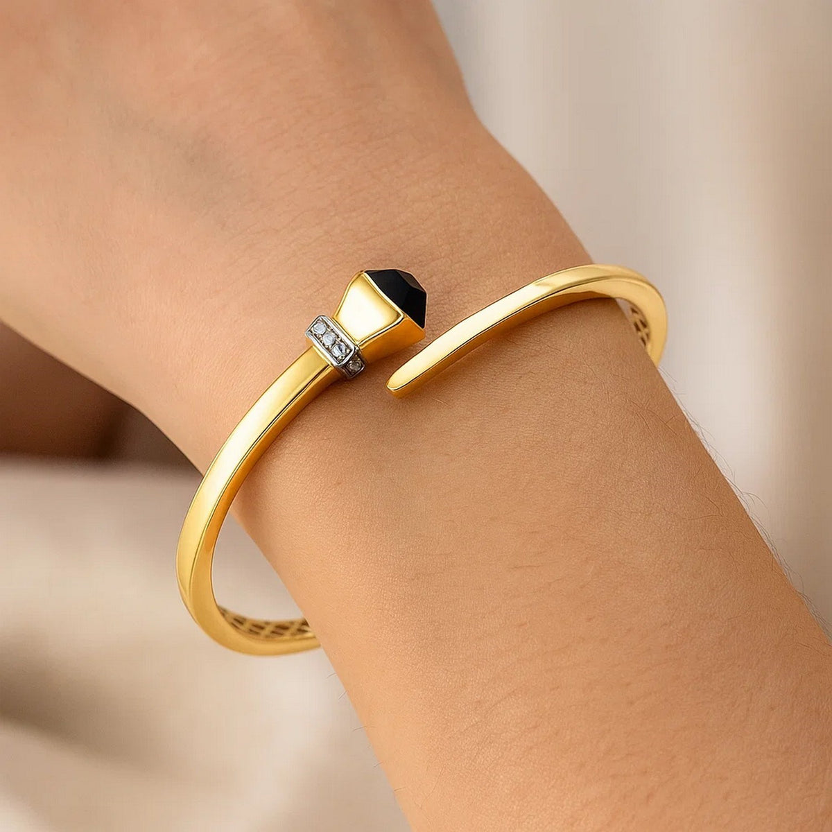 Black Onyx & Diamond Crossover Bangle in 14K Yellow Gold, worn