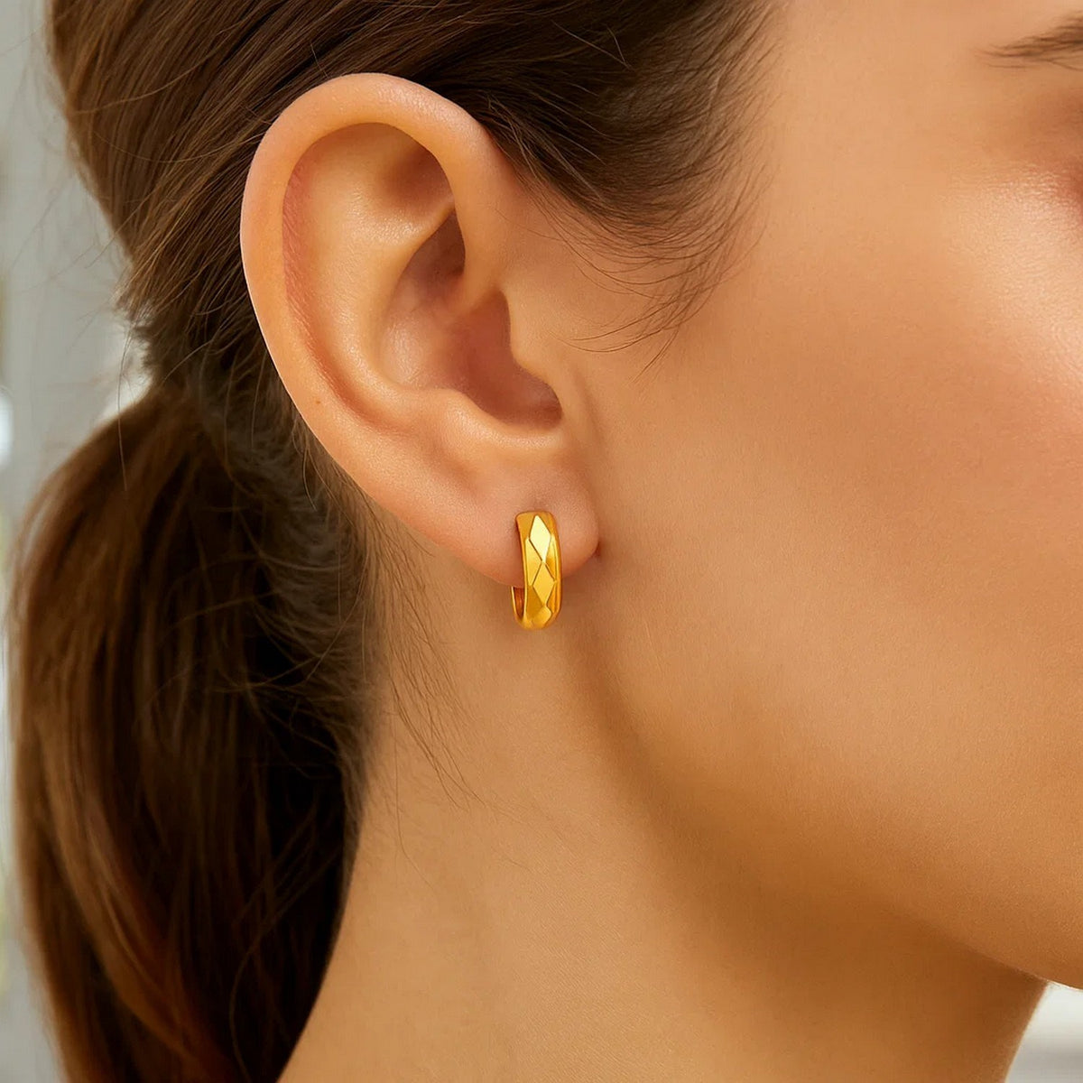 Faceted Huggie Hoop Earrings in 14K Yellow Gold, worn