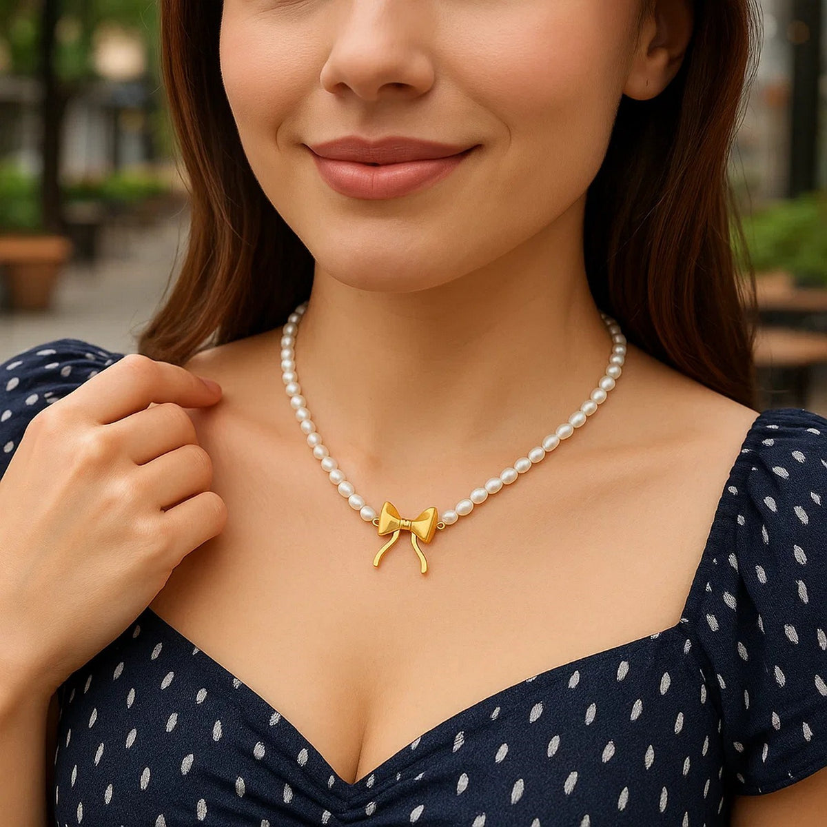 Pearl Strand Necklace with Gold Bow in 14K Yellow Gold, worn