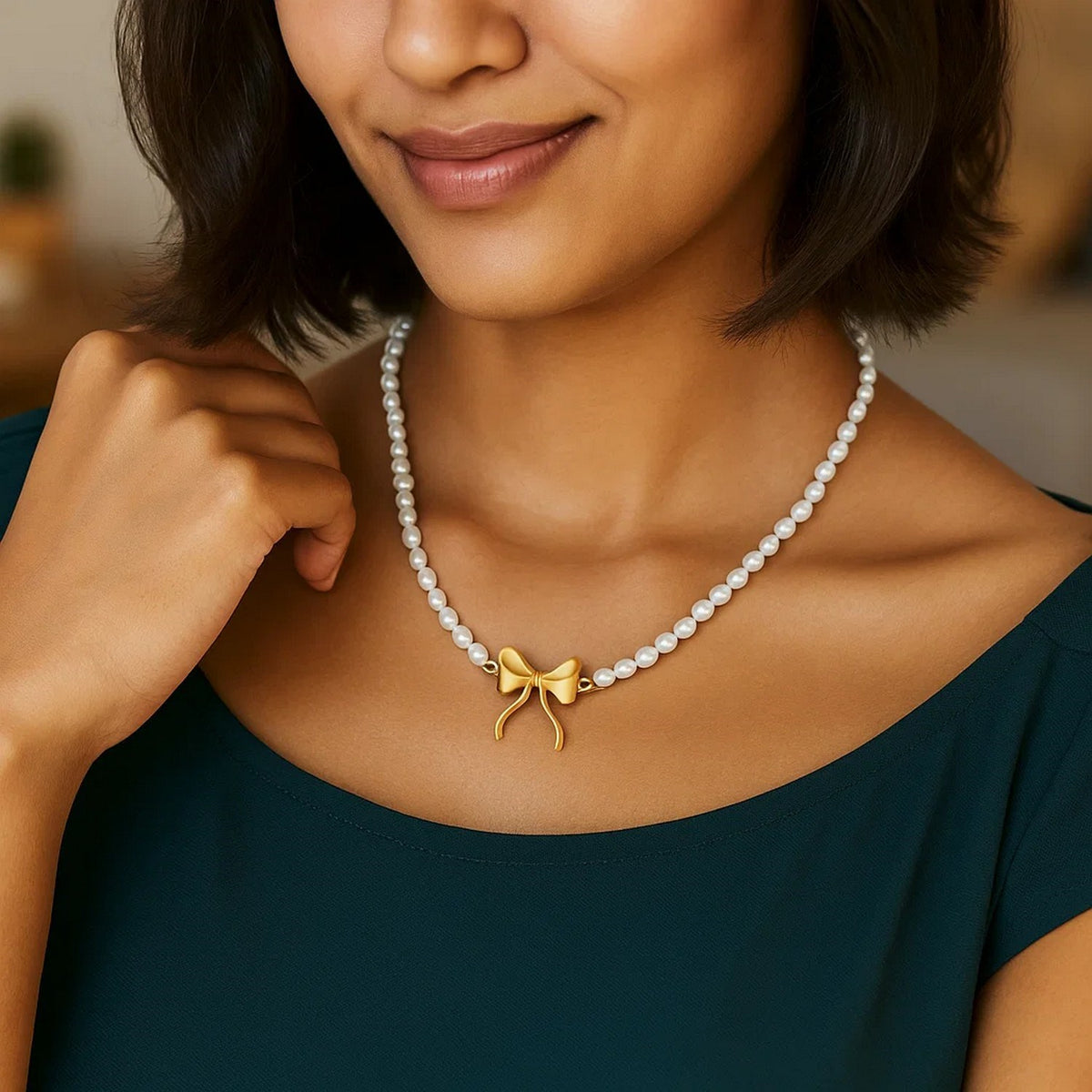 Pearl Strand Necklace with Gold Bow in 14K Yellow Gold, worn