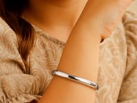 Dome Children's Bangle with a Polished Finish in 14K White Gold — product video