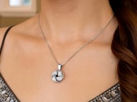 Textured Love Knot Pendant Necklace in Sterling Silver — product video
